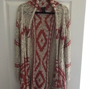 Plus size, rust and tan sweater shawl.